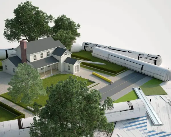 Model domu z planami i materiałami budowlanymi. Część budynku na działce sąsiada, symbolizująca projektowanie i planowanie.